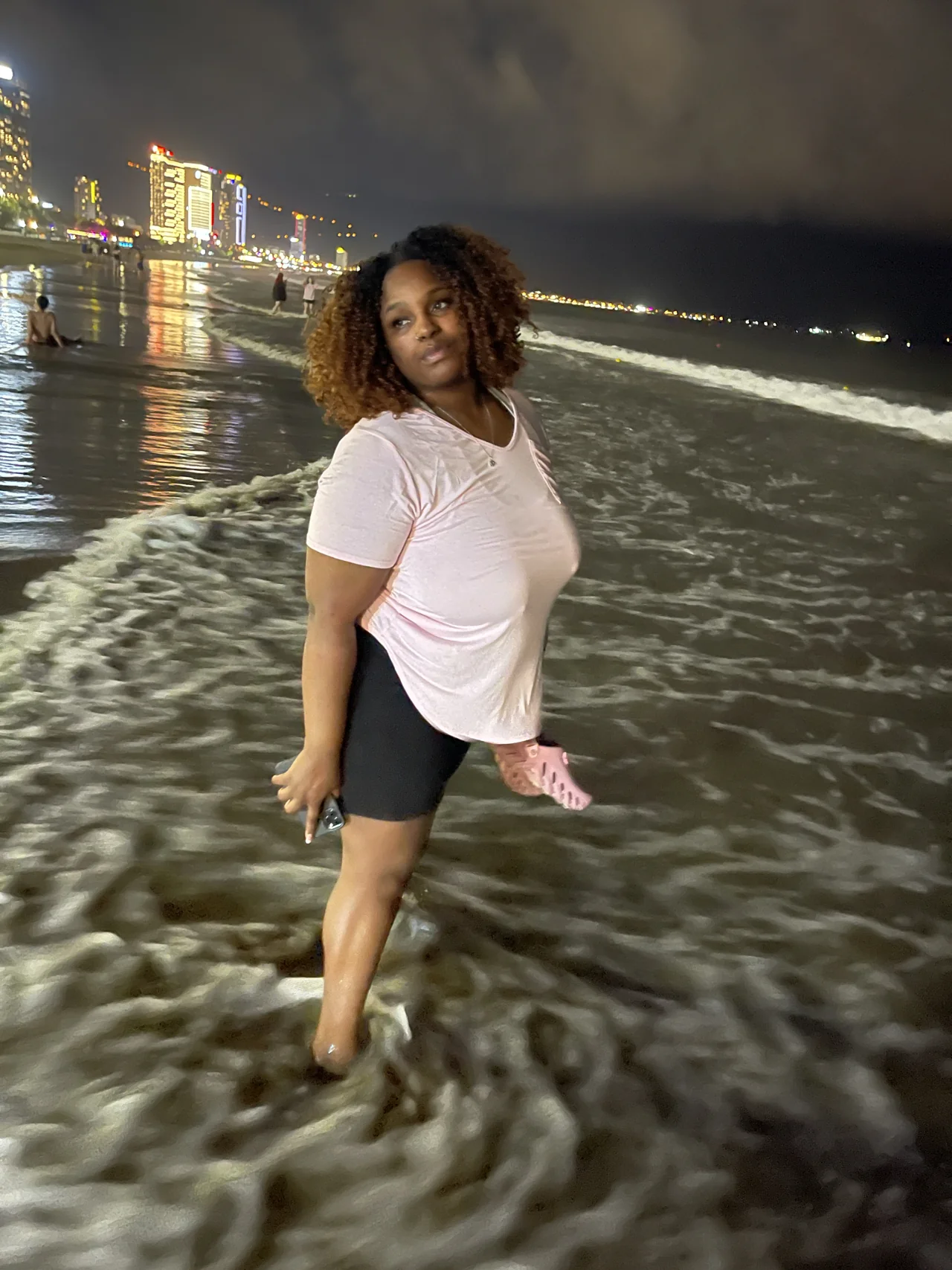 Amia smiling on the beach