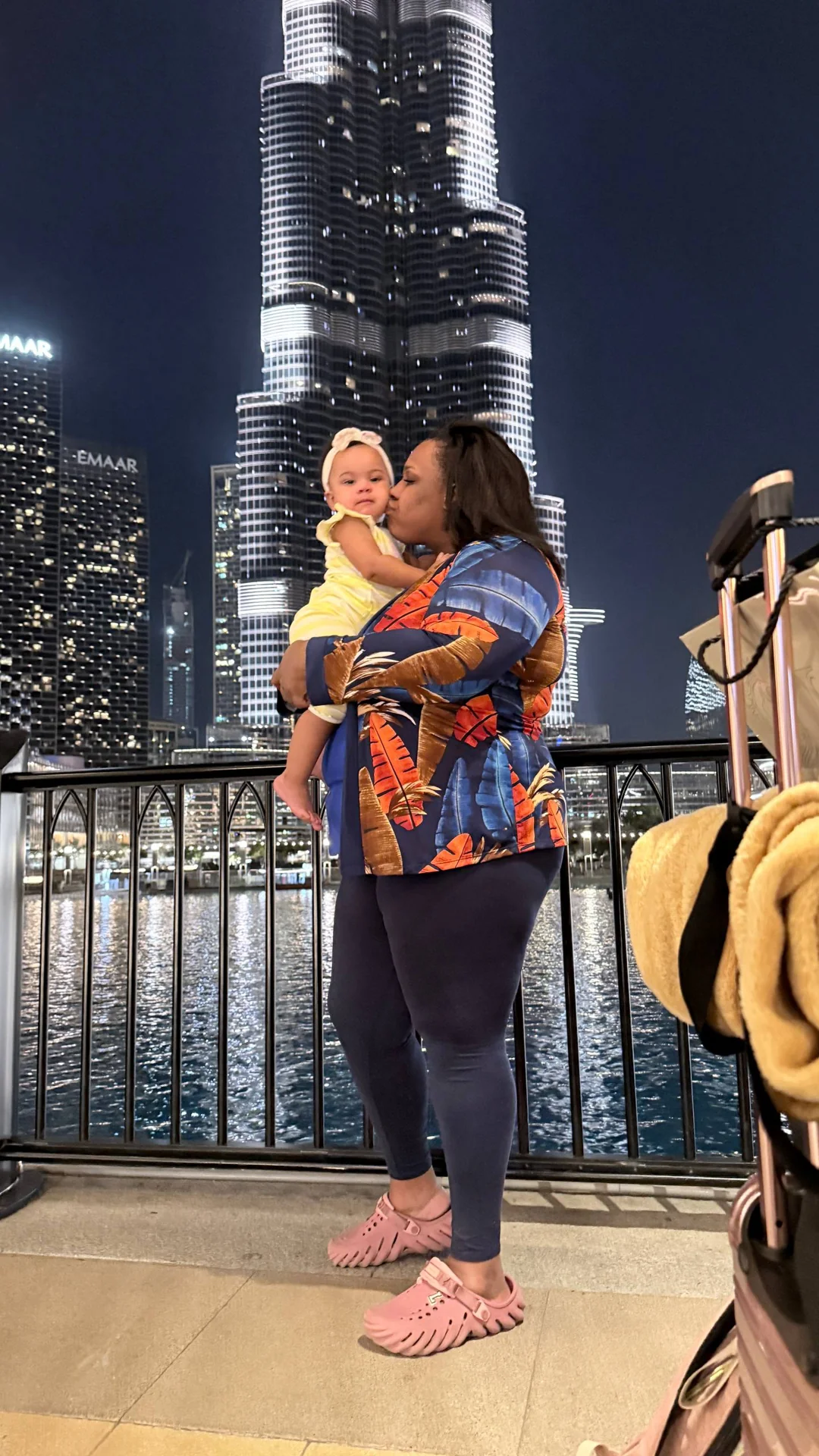 Amia and her baby in front of the Burj Khalifa in Dubai